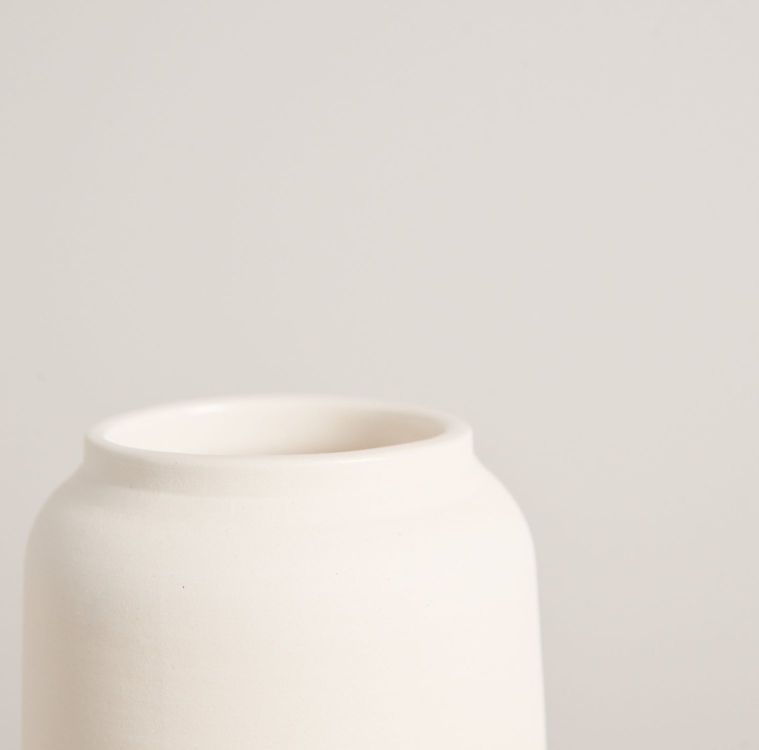 White unglazed ceramic vase by L'Impatience