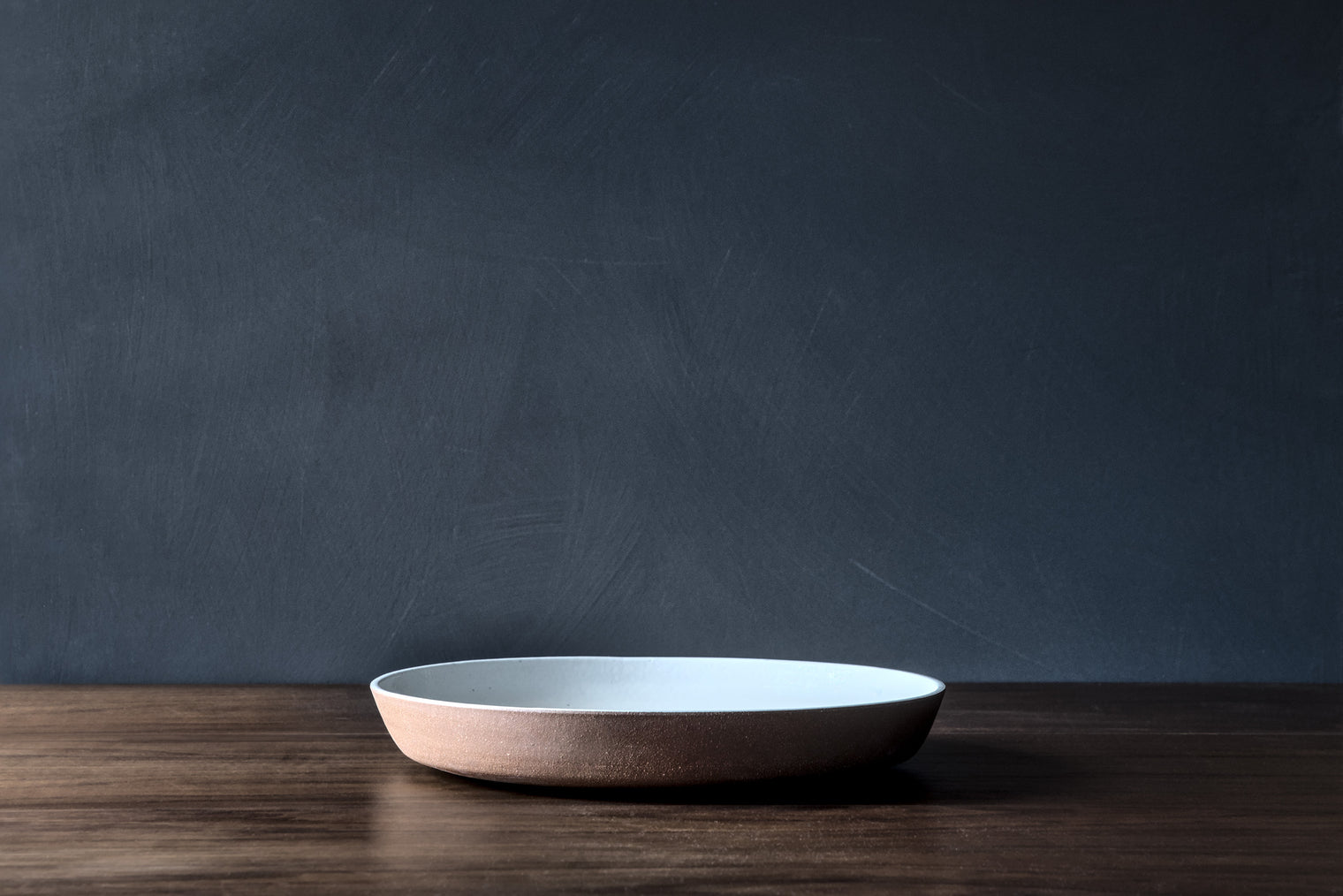 White Statement Serving Platter on Red clay