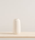 Elegant white vase by L'Impatience studio